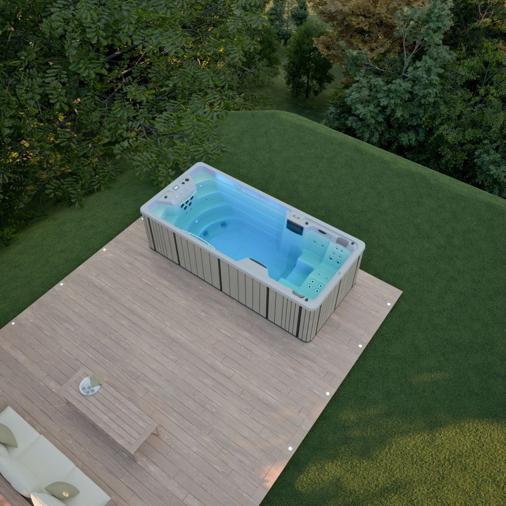 Jacuzzi ogrodowe z podświetlaną wodą na drewnianym tarasie przy domu.