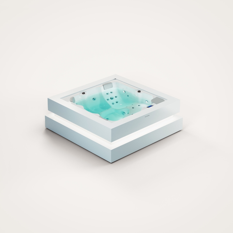 Kwadratowa wanna spa z hydromasażem i podświetleniem na białym tle.
