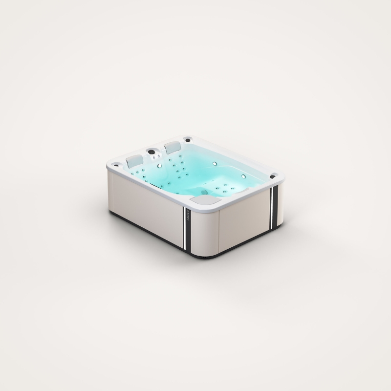 Nowoczesna wanna spa z podświetlaną na błękitno wodą.