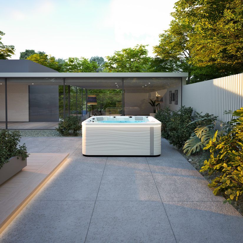 Nowoczesne jacuzzi ogrodowe z podświetleniem na tarasie nowoczesnego domu.