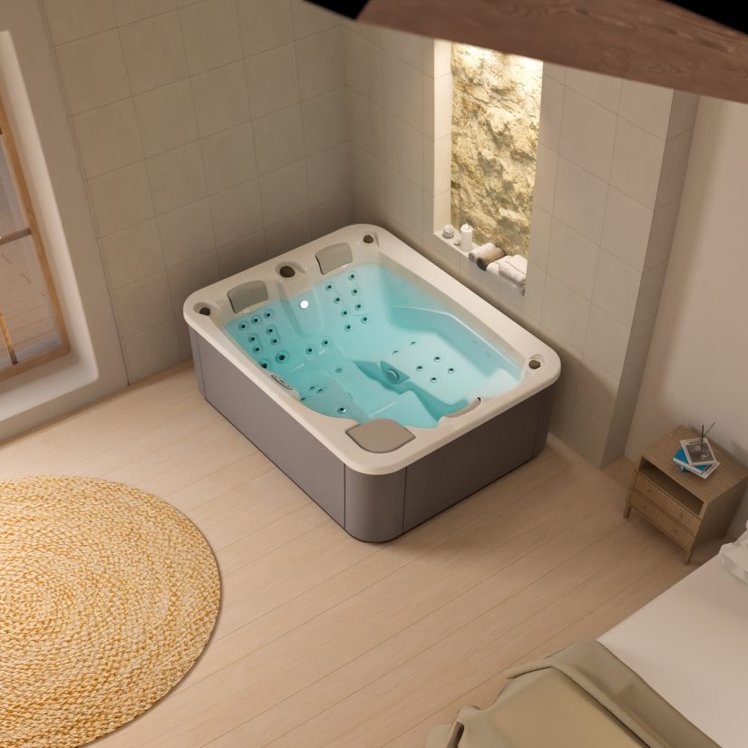 Nowoczesna wanna z hydromasażem w jasnej łazience z podświetlaną wnęką i okrągłym dywanem.